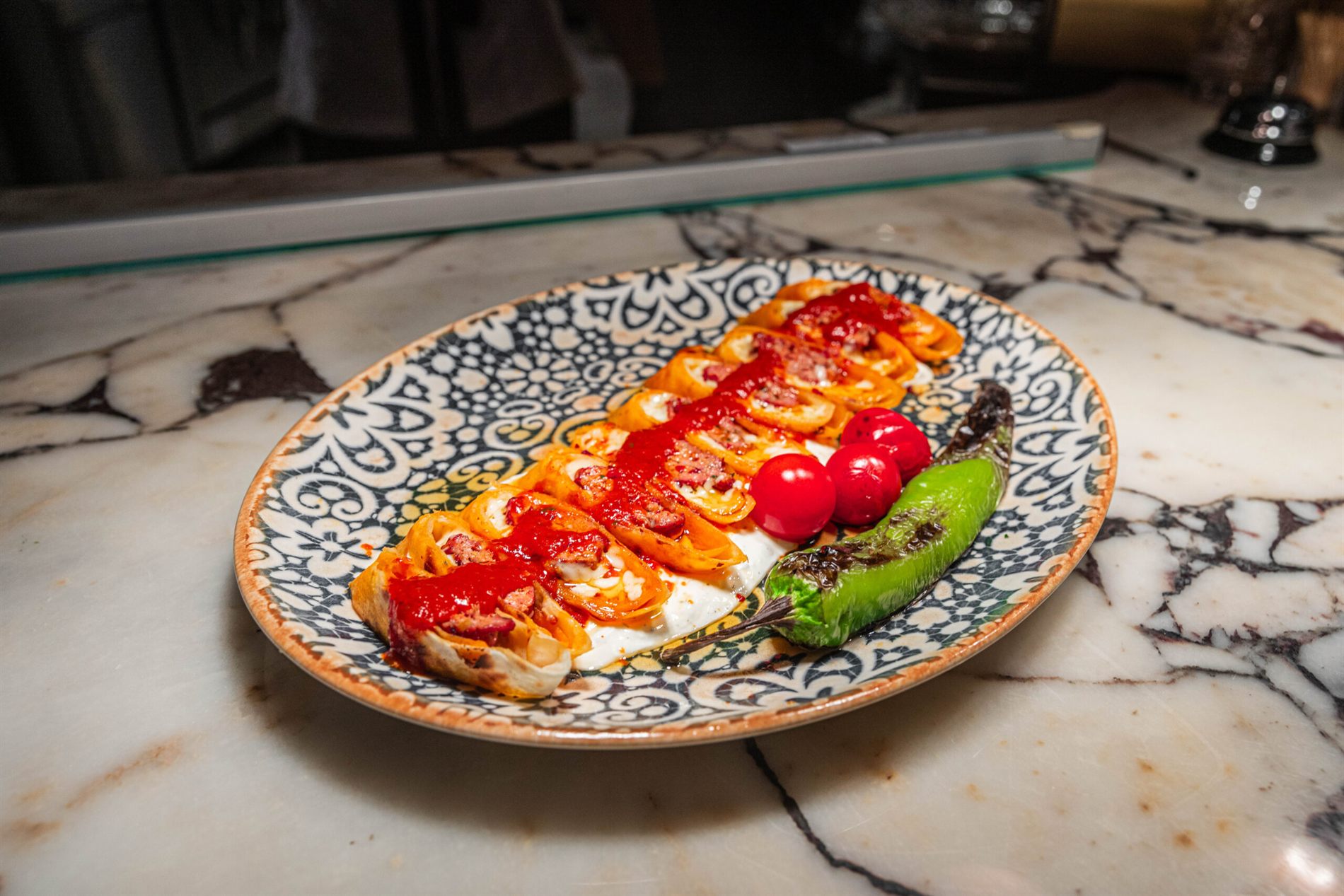 Adana kebab with grilled peppers and tomato