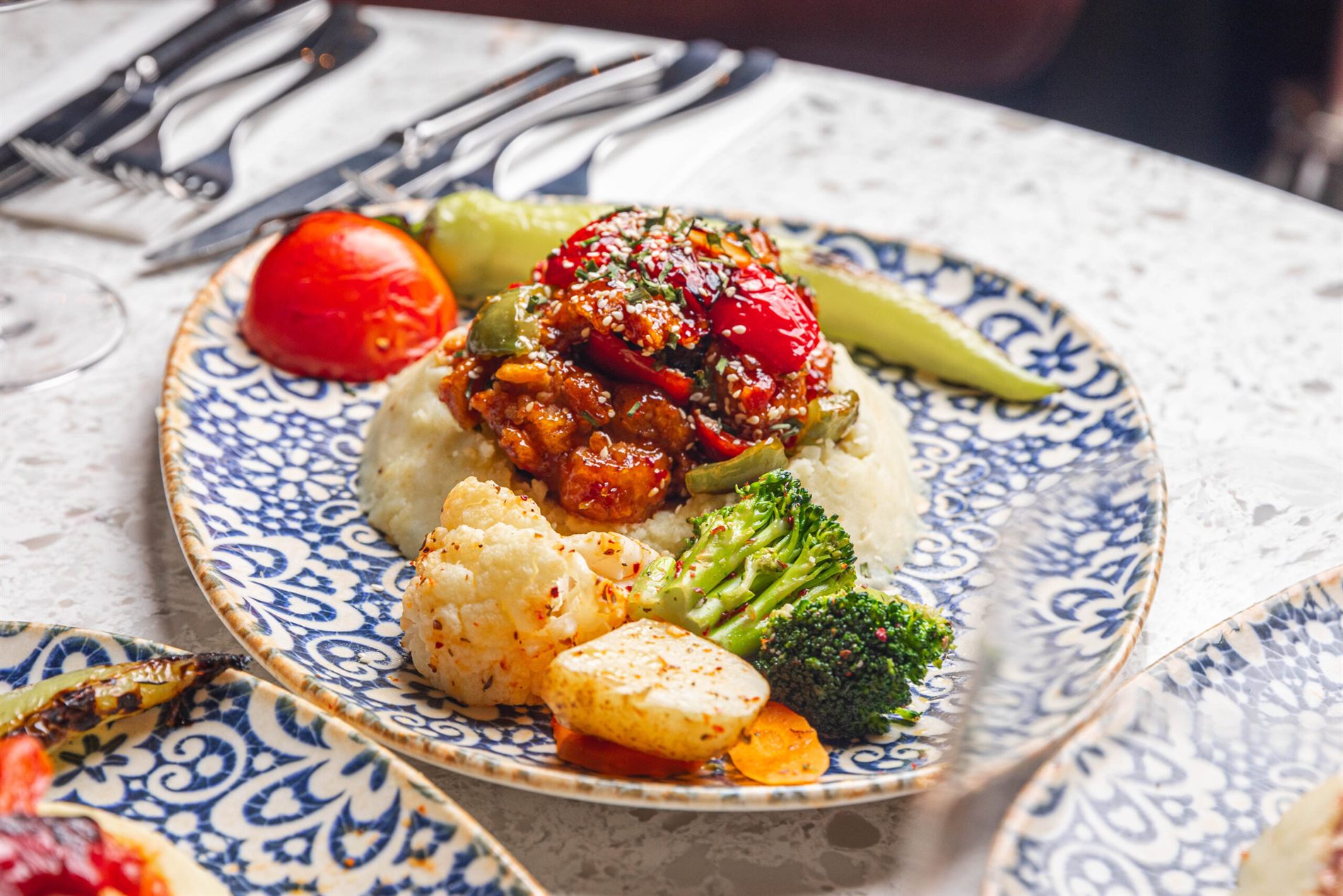 A plated chicken main course at Elif