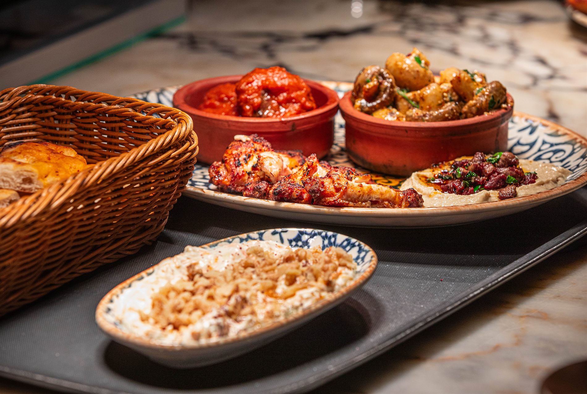 A spread of mezze with bread at Elif